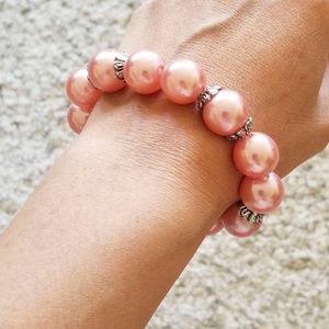 Pink pearl-like bracelet with silver accents